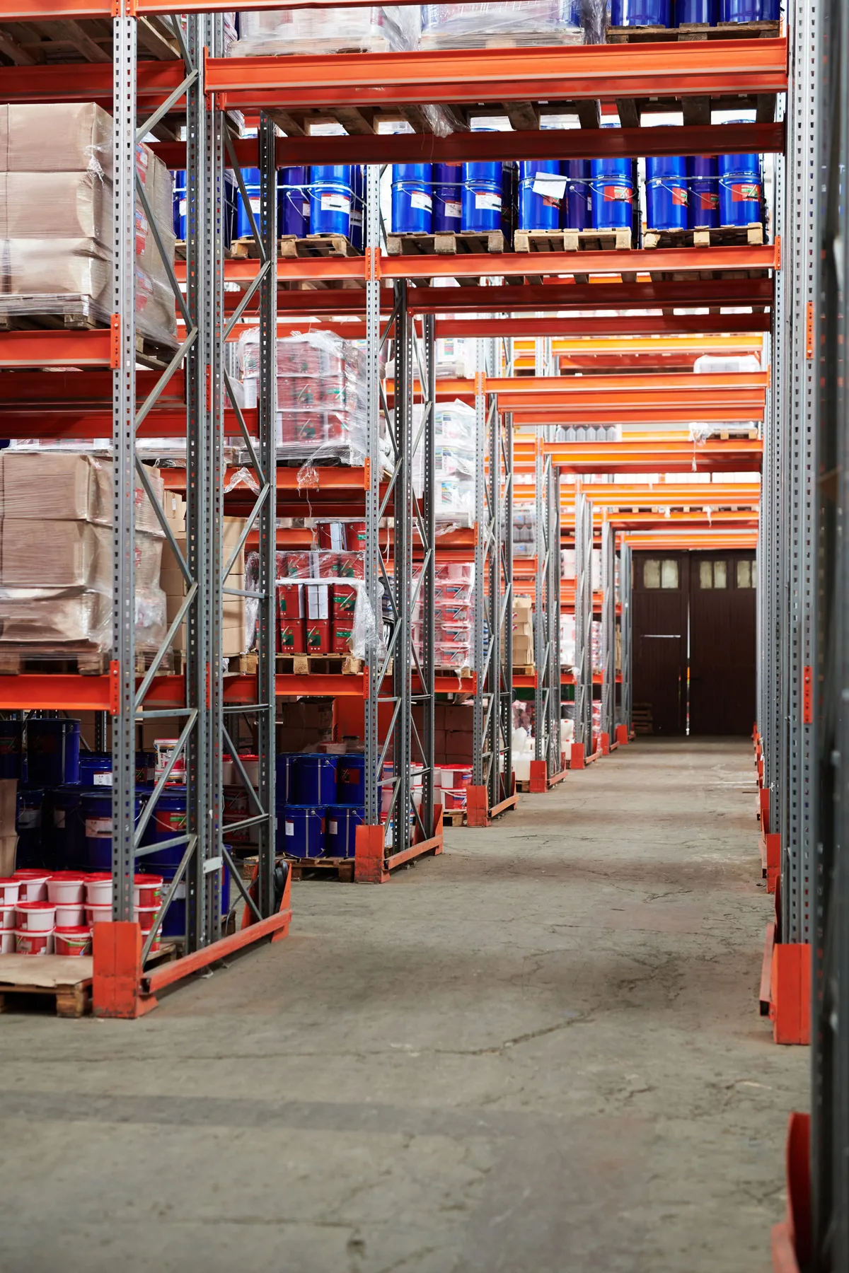 Illustrative warehouse aisle with storage racks and concrete floor